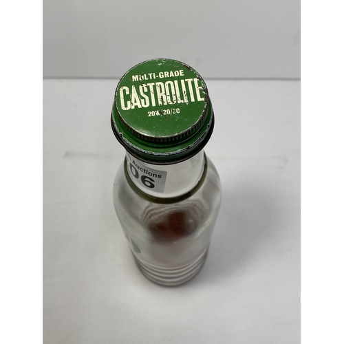 206 - A Castrol Motor Oil glass bottle with label in good condition.