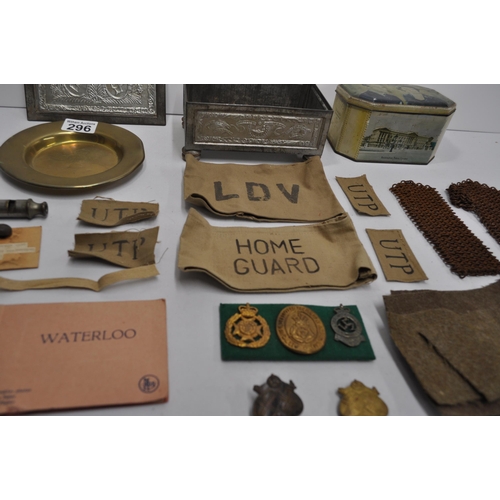 296 - Mixture of military items to incude RFC brass circular tray, badges, buttons, cloth badges, Metropol... 