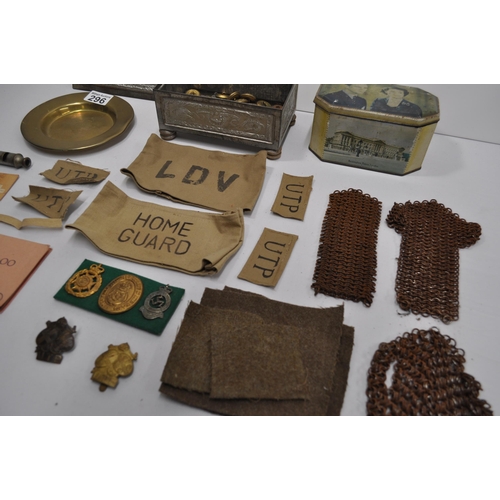 296 - Mixture of military items to incude RFC brass circular tray, badges, buttons, cloth badges, Metropol... 