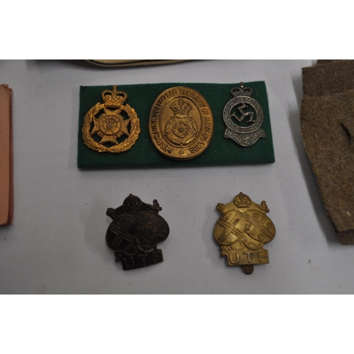 296 - Mixture of military items to incude RFC brass circular tray, badges, buttons, cloth badges, Metropol... 