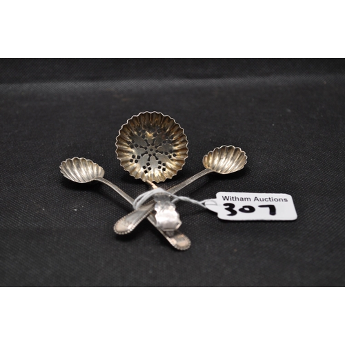 307 - A pair of silver shell design spoons together with sifter spoon hallmarked Birmingham