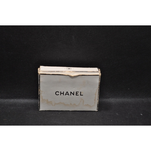 40 - Chanel box with miniature glass perfume bottles No.5, Cuir de Russie, Bois des Iles, Gardenia,  c.19... 