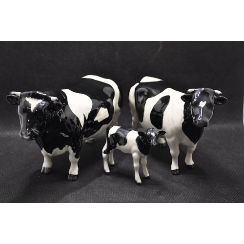 134 - Beswick Friesian Cow Family comprising CH. Coddington Hilt Bar bull, CH. Claybury Leegwater cow and ... 