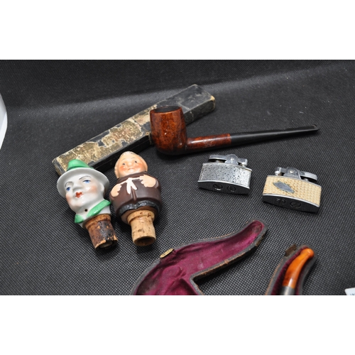 238 - Two pipes to include a vinatge IRSEAGLE pipe and a vintage pipe in the shape of a hand holding a pot... 