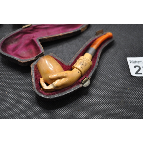 238 - Two pipes to include a vinatge IRSEAGLE pipe and a vintage pipe in the shape of a hand holding a pot... 