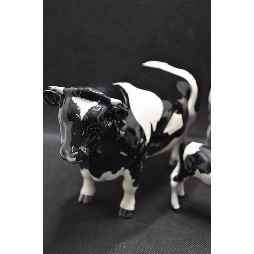 134 - Beswick Friesian Cow Family comprising CH. Coddington Hilt Bar bull, CH. Claybury Leegwater cow and ... 