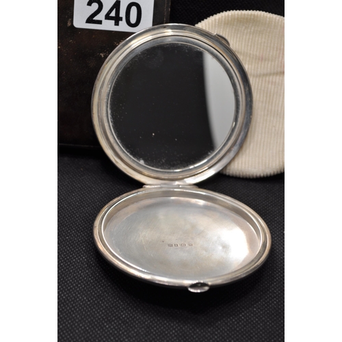 240 - A silver mirrored compact, hallmarked Birmingham 1944-5 with maker stamp Charles Green & Co. in a le... 