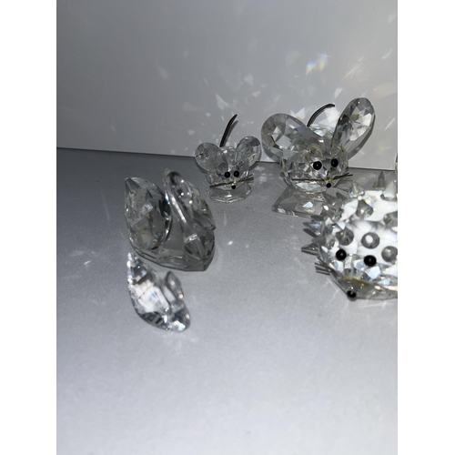 98 - A group of Swarovski crystal figures to include mice, swans, elephant, owl etc. X9 in total