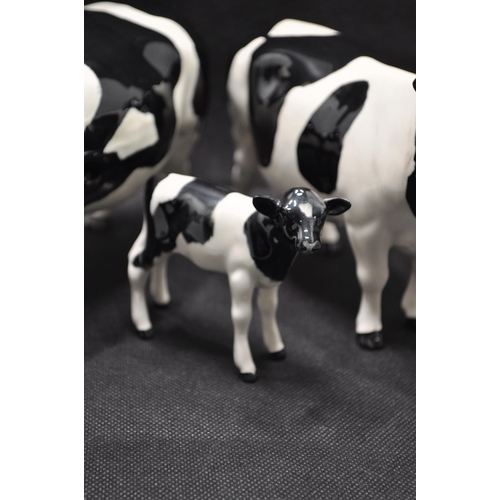 134 - Beswick Friesian Cow Family comprising CH. Coddington Hilt Bar bull, CH. Claybury Leegwater cow and ... 