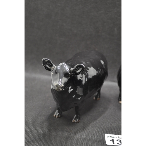 137 - Two Beswick cattle comprising Aberdeen Angus Bull and Aberdeen Angus Cow, both in black gloss with g... 