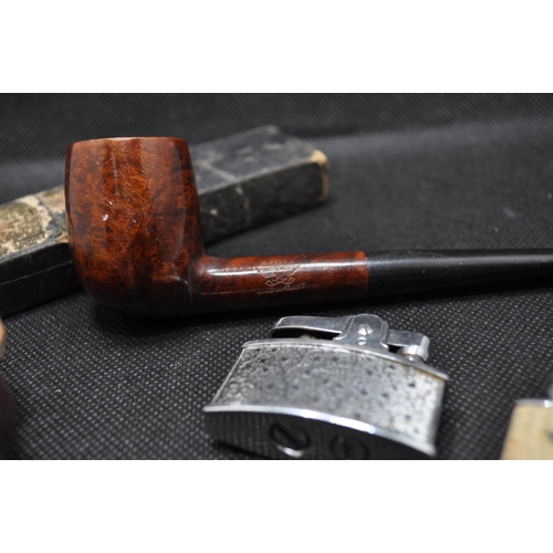 238 - Two pipes to include a vinatge IRSEAGLE pipe and a vintage pipe in the shape of a hand holding a pot... 