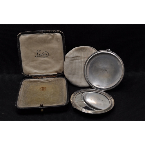 240 - A silver mirrored compact, hallmarked Birmingham 1944-5 with maker stamp Charles Green & Co. in a le... 