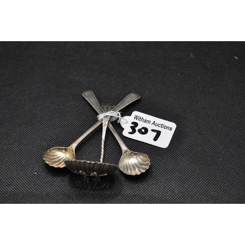 307 - A pair of silver shell design spoons together with sifter spoon hallmarked Birmingham