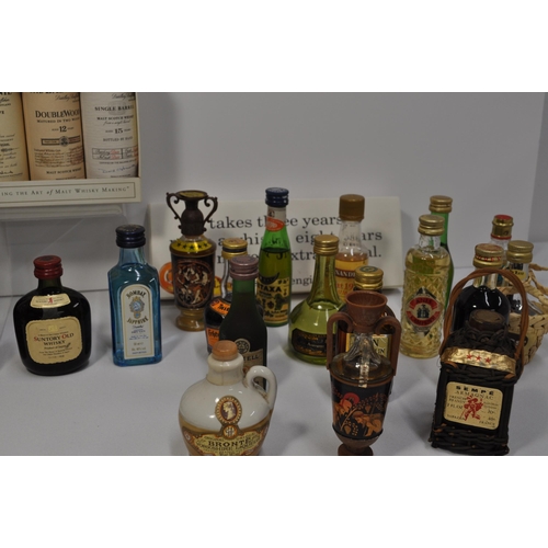 51 - A collection of miniature alcohols to include whisky, gin, tequila, mead and liqueur's featuring, Bo... 