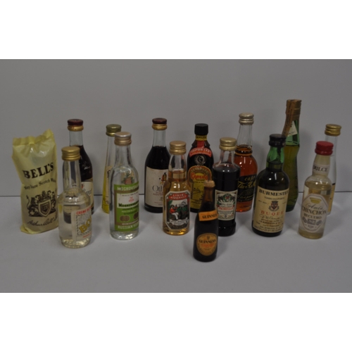 52 - A collection of miniature alcohols to include whisky, wine, port, and liqueur's featuring Glenmorang... 