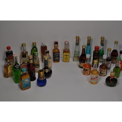 53 - A collection of miniature alcohols to include whisky, brandy, gin and liqueur's featuring Glenfiddic... 