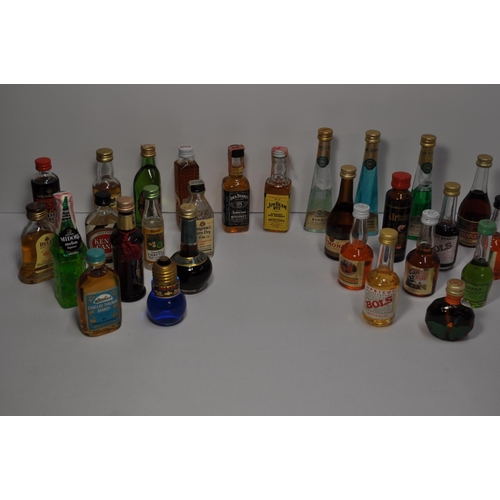 53 - A collection of miniature alcohols to include whisky, brandy, gin and liqueur's featuring Glenfiddic... 