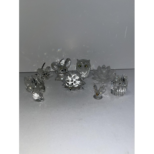 98 - A group of Swarovski crystal figures to include mice, swans, elephant, owl etc. X9 in total