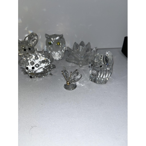 98 - A group of Swarovski crystal figures to include mice, swans, elephant, owl etc. X9 in total