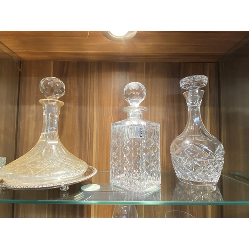 67 - A large quantity of quality cut crystal/glassware items to include decanters and drinking vessels in... 