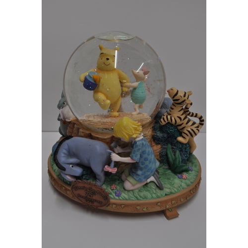 44 - Disney Exclusive Winnie the Pooh Light up Christmas figurine together with Winnie the Pooh 75th anni... 