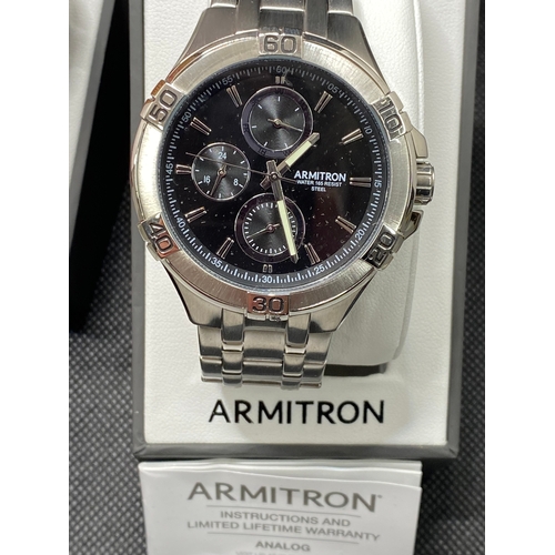 29 - A collection of three watches to included two Armitron men's as new with box, with proof of purchase... 