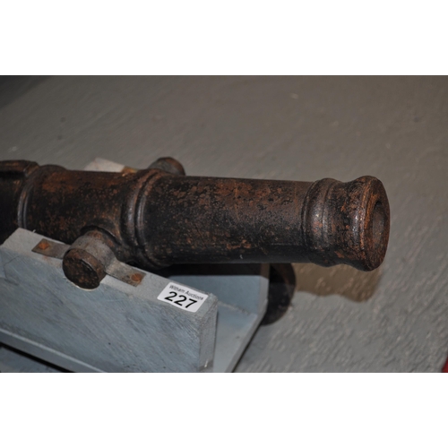 227 - Cannon, cast iron barrel of approx 48cm on stepped carriage