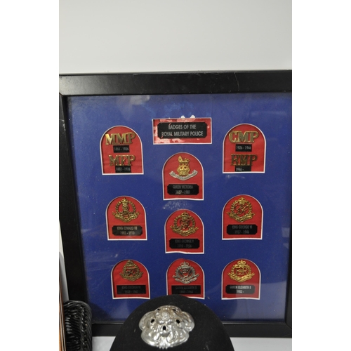 229 - A collection of police items to include a Essex Police hat plus one other, framed and unframed badge... 