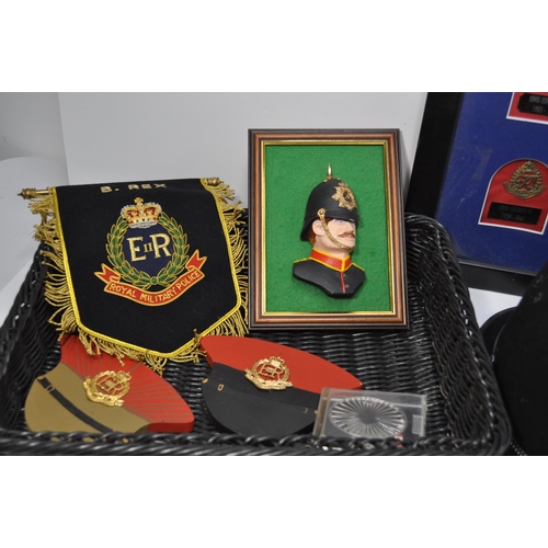 229 - A collection of police items to include a Essex Police hat plus one other, framed and unframed badge... 