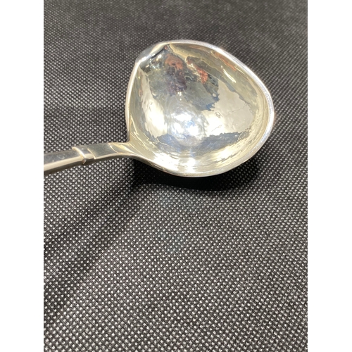 249 - Sauce spoon with hammered design to the bowl leading to clear Perspex handle, stamped 925 to stem, a... 