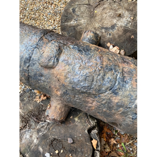 196 - Large antique ship's cannon barrel, GR with carriage wheels and other carriage items. Also included ... 