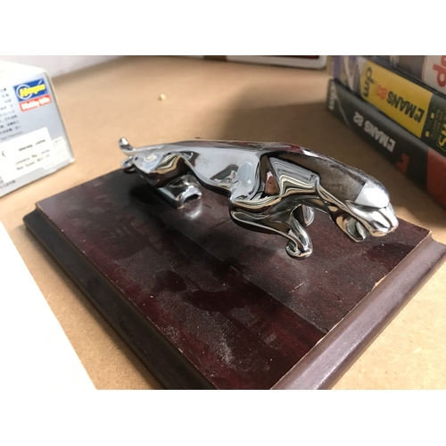 199 - Jaguar / Motor Racing items; to include iconic leaping Jaguar chrome emblem mascot mounted on wooden... 