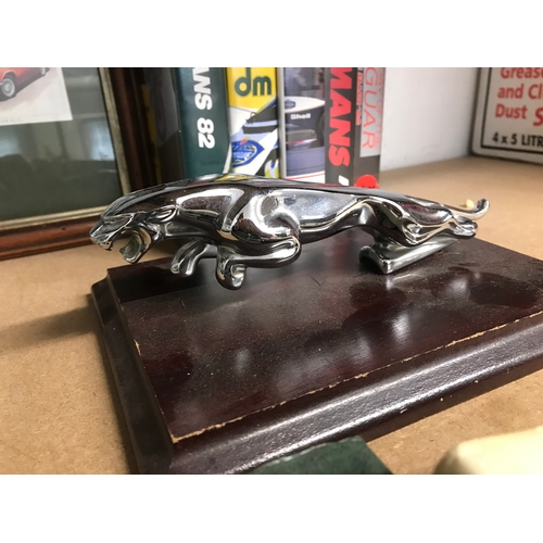 199 - Jaguar / Motor Racing items; to include iconic leaping Jaguar chrome emblem mascot mounted on wooden... 