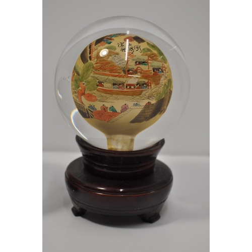 22 - Two vintage oriental reverse hand painted glass sphere/globe on stands, with signatures, approx diam... 