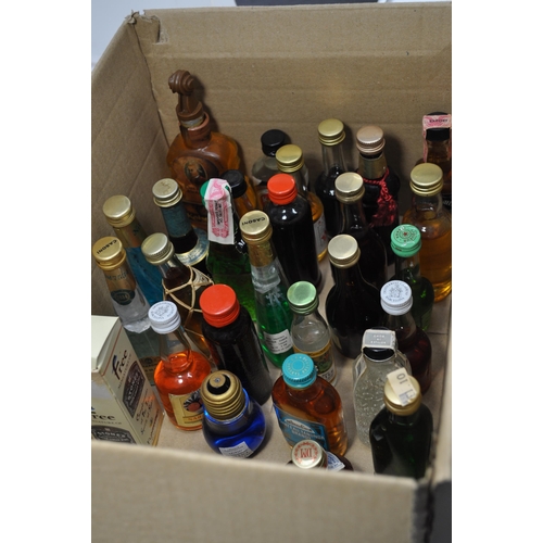 42 - A collection of miniatures including whiskey, bourbon, liqueurs, gins and vodkas etc. (X62 bottles i... 