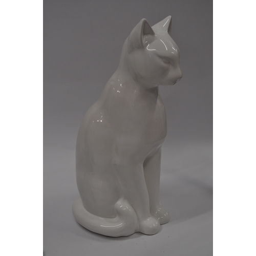 17 - A white ceramic cat in seated position (approx height 48cm) together with a black art deco style Jag... 