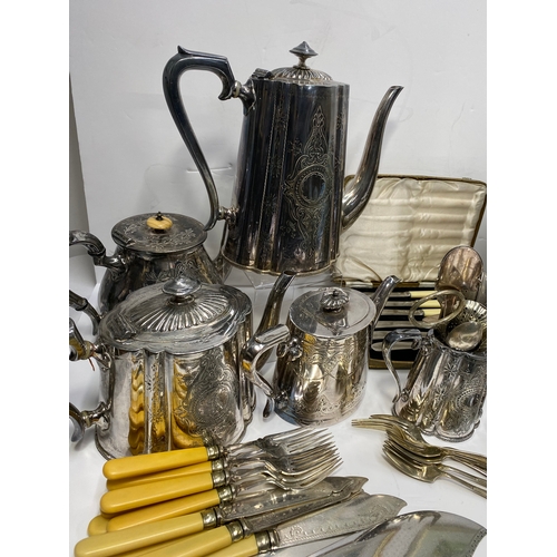 36 - A quantity of antique and vintage silverplate items inc. biscuit barrel, teapot, ladles, flatware et... 