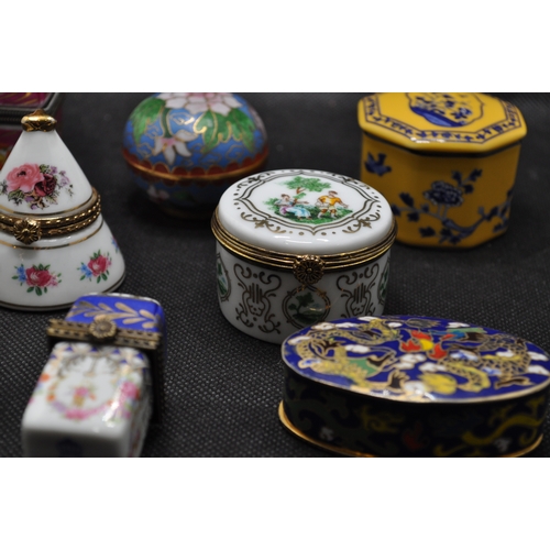 39 - Group of porcelain and enamel trinket boxes of various design, some containing glass bottles, x8 ite... 