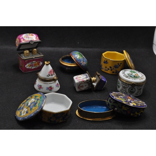 39 - Group of porcelain and enamel trinket boxes of various design, some containing glass bottles, x8 ite... 