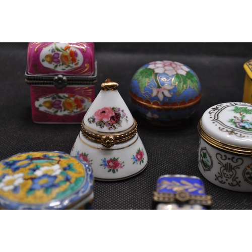 39 - Group of porcelain and enamel trinket boxes of various design, some containing glass bottles, x8 ite... 