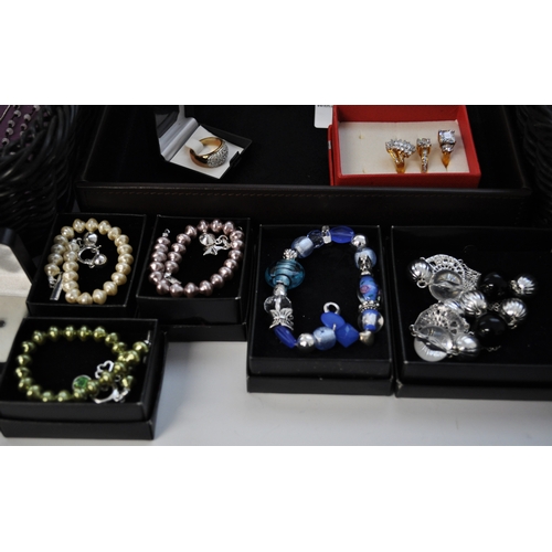 1 - A large quantity of costume jewellery to include necklaces, bracelets, bangles, earrings, rings etc.