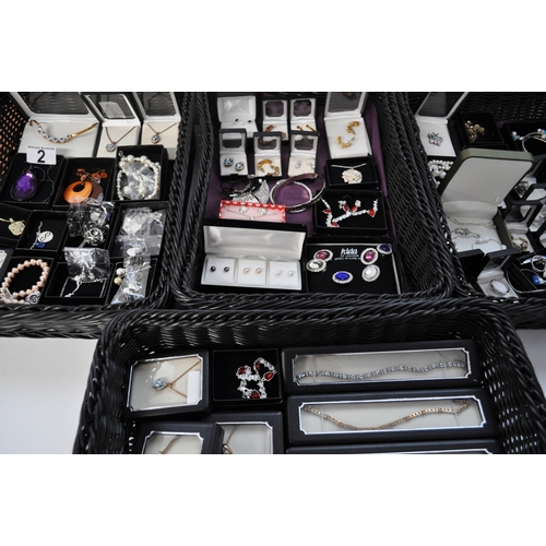 2 - A large quantity of costume jewellery to include necklaces, bracelets, bangles, earrings, rings etc.