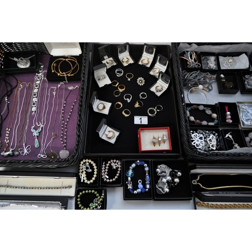 1 - A large quantity of costume jewellery to include necklaces, bracelets, bangles, earrings, rings etc.