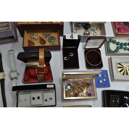 4 - A large quantity of costume jewellery to include bracelets, watches, necklaces, rings etc.