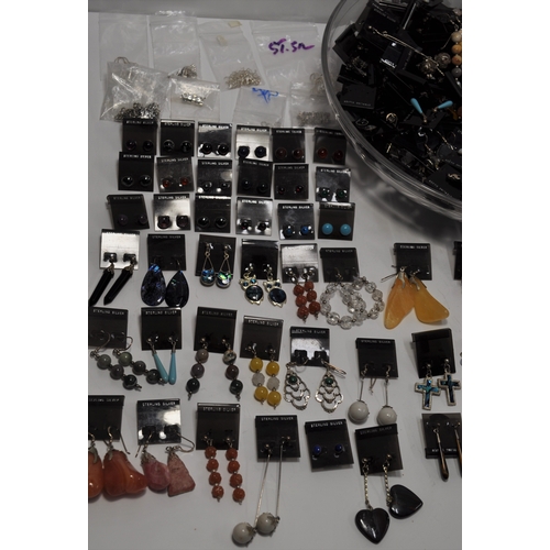 6 - A large quantity of jewellery making items consisting predominately earrings, some silver and semi p... 