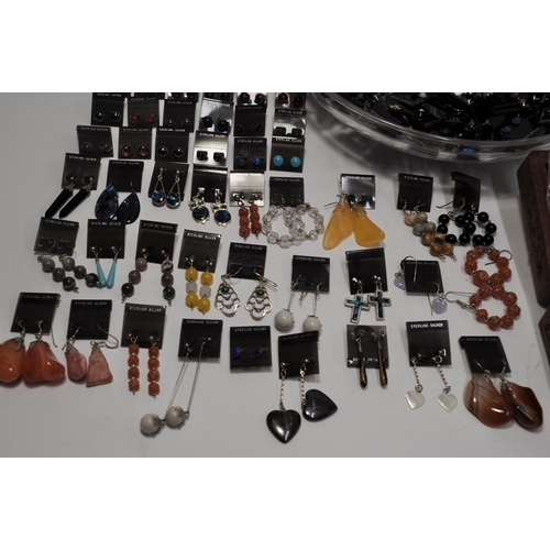 6 - A large quantity of jewellery making items consisting predominately earrings, some silver and semi p... 