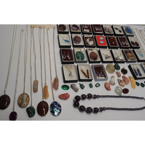 7 - A large quantity of silver jewellery items, some with semi precious stones consisting  various penda... 