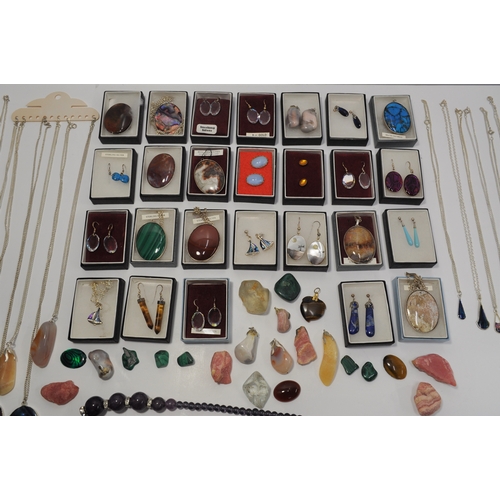 7 - A large quantity of silver jewellery items, some with semi precious stones consisting  various penda... 