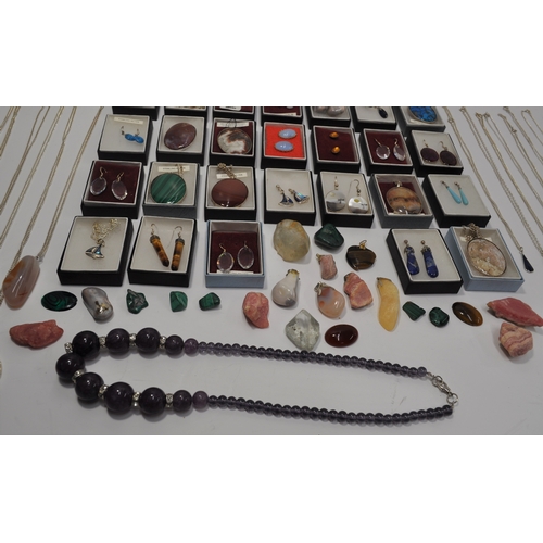 7 - A large quantity of silver jewellery items, some with semi precious stones consisting  various penda... 