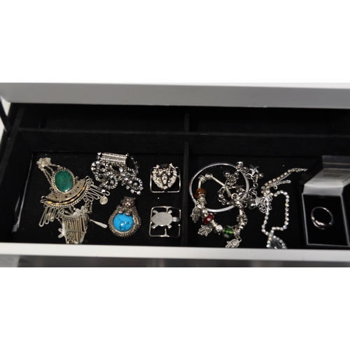 11 - A quantity of costume jewellery to include a selection of different watches, rings, necklaces, brooc... 